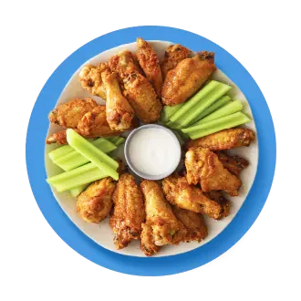 Tray of wings on a blue background